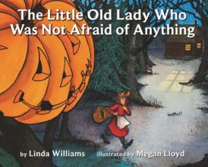 The cover of the book The Little Old Lady Who Was Not Afraid of Anything includes an old lady walking down a road with a huge jack o lantern watching