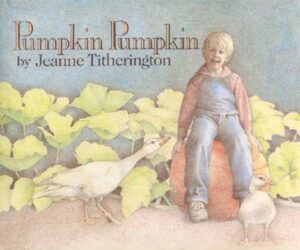 The cover of the book Pumpkin Pumpkin includes a little boy sitting in a pumpkin patch next to a goose