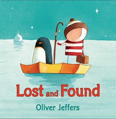 The cover of the picture book Lost and Found, which shows a penguin and boy floating in an umbrella in the ocean