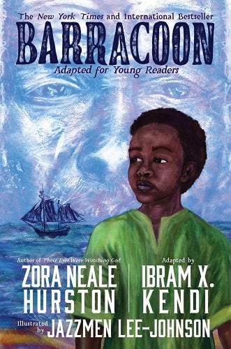 The cover of the young adult adaptation of the book "Barracoon," which includes an illustration of a black boy in a green shirt looking out at a ship on the sea with a man's face in the clouds behind him
