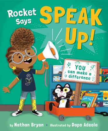 The cover of the picture book Rocket Says Speak Up! Which includes an illustration of a young black girl with glasses and a blue shirt and a cat holding a sign that says "you can make a difference"
